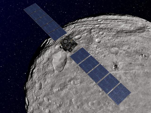 Vue d'artiste de la sonde Dawn, en orbite autour de Vesta