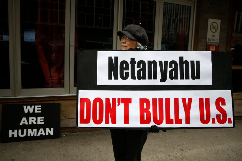 A demonstrator holds a sign during a rally near the Israeli Consulate in New York March 3, 2015.
