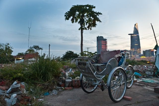 Opposite worlds between this cyclo and the Bitexco tower. In Dist 2, HCMC
