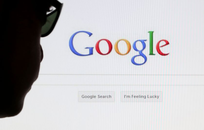 A computer user poses in front of a Google search page.