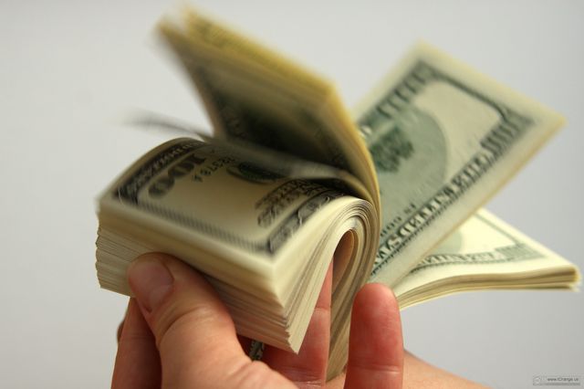 Dollars in fingers (Free photobank www.tOrange.us)