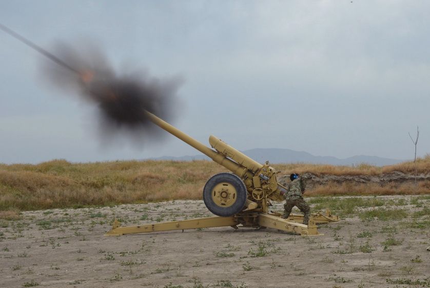 Afghan National Army soldiers fire artillery during a battle with Taliban insurgents in Kunduz, Afghanistan.