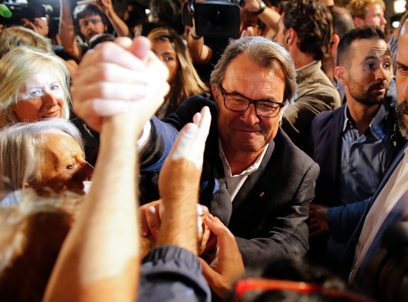Catalan President Artur Mas greets supporters of Junts Pel Si (Together For Yes) after polls closed in a regional parliamentary