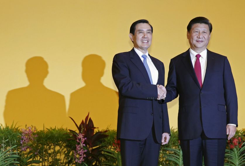Chinese President Xi Jinping shakes hands with Taiwan's President Ma Ying-jeou.