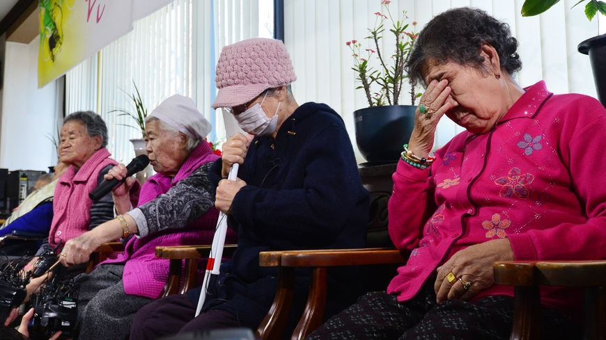 South Korean "comfort woman" Lee Ok-sun speaks as the others react during a news conference at the "House of Sharing," a special