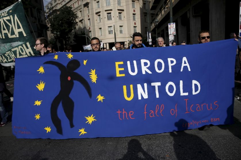 Protesters hold a banner during an anti-austerity demonstration in Athens