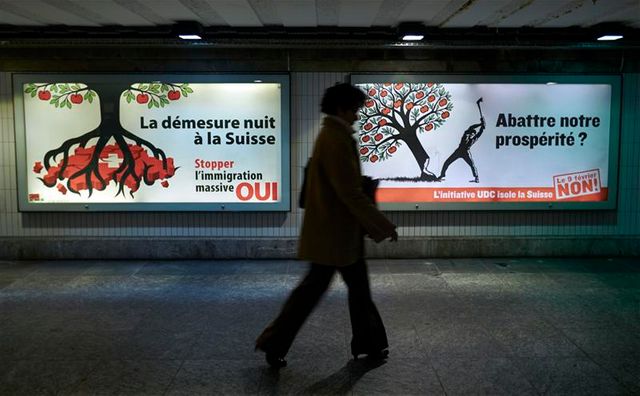 les suisses approuvent à une courte majorité les quotas d'immigration