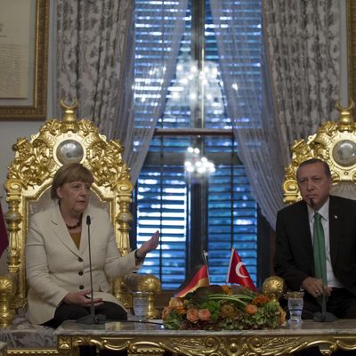 German Chancellor Angela Merkel (L) talks after her meeting with Turkish President Tayyip Erdogan in Istanbul.