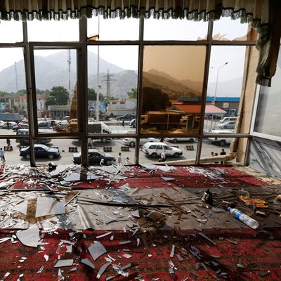 Broken glass and debris are seen inside a resturant a day after a suicide attack in Kabul