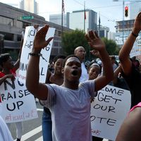 Demonstrators march to protest the police shooting of Keith Scott in Charlotte