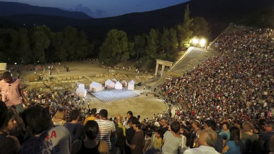 Spectators are seen before a performance of Aristophanes' 2,400-year-old play "Ecclesiazusae" (The Assembly Women) at the ancient Greek amphitheatre of Epidaurus, southern Greece August 1, 2015 ©Reuters - Reuters staff