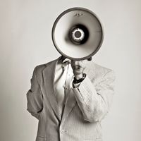 USA, Pennsylvania, Mercersburg, Studio portrait of man talking into megaphone