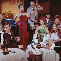 People in restaurant listening musical performance