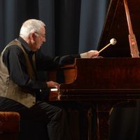 Pianist John Tilbury performs on stage at Bishopsgate Institute during London Jazz Festival 2012