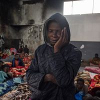 Un migrant dans un centre de détention en Libye