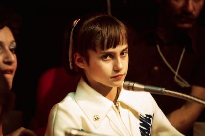 Nadia Comaneci, 14 ans, apparemment décontenancée par l'attention mondiale qui lui a été réservée après son triomphe en gymnastique à Montréal, a déclaré: "Je me sens comme avant, plutôt bien, rien de spécial." Nadia Comaneci, 14 ans, apparemment décontenancée par l'attention mondiale qui lui a été réservée après son triomphe en gymnastique à Montréal, a déclaré: "Je me sens comme avant, plutôt bien, rien de spécial."