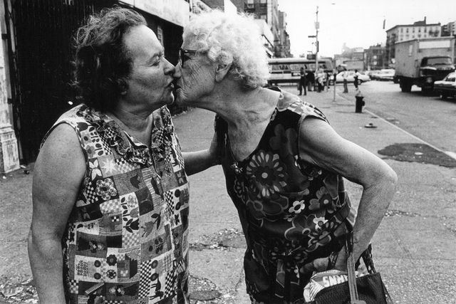 Arlene Gottfried - Sometimes overwhelming - Mommie kissing Bubbie on Delancey Street New York, 1979