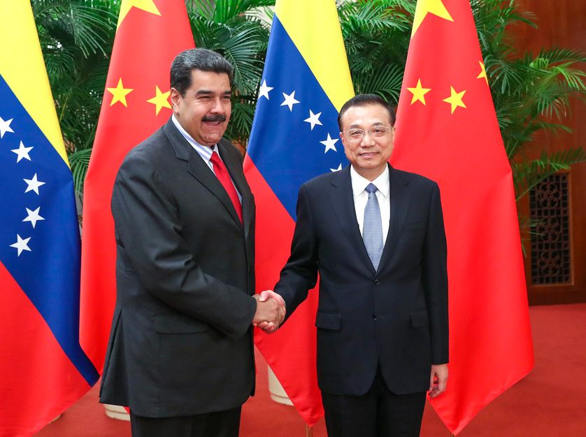 BEIJING, CHINA - SEPTEMBER 14: China's Premier Li Keqiang (R) shakes hands with Venezuelan President Nicolas Maduro during their meeting at the Great Hall of the People on September 14, 2018 in Beijing, China.