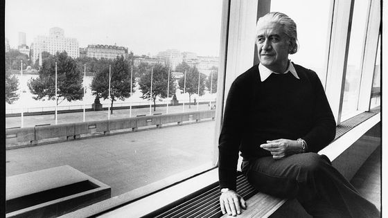 Musician Sergiu Celibidache sits on a windowsill at the South Bank Centre ©Corbis - Hulton-Deutsch Collection