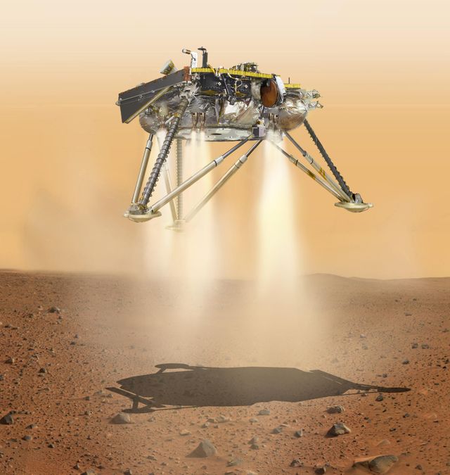 Après avoir déployé son parachute, les rétrofusées d'Insight s'allument (vue d'artiste)