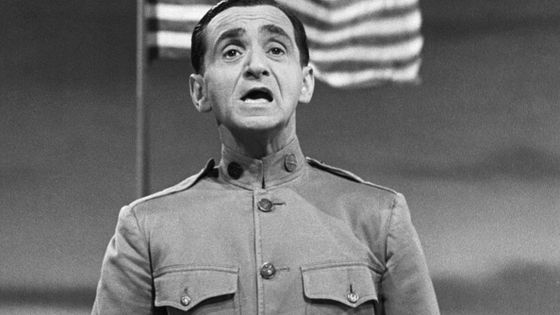 (Original Caption) Irving Berlin singing his famed 'Oh How I Hate to Get Up in the Morning,' song hit of World War I. Photograph, 1943. ©Getty - Breitmann