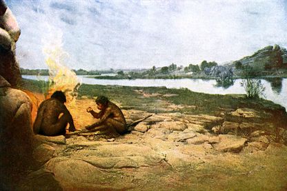 Deux hommes préhistoriques expérimentant le feu Deux hommes préhistoriques expérimentant le feu