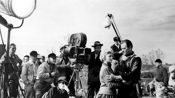 On the set of "The Horse Soldiers" American actors Constance Towers and John Wayne with director John Ford. ©Getty - by Sunset Boulevard/Corbis via Getty Images