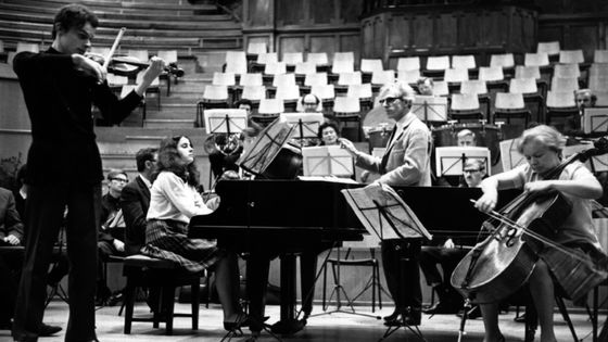 Paul Tortelier (1914 - 1990) (centre) conducts members of his family: from left, his son Yan Pascal, on the violin, daughter and pianist Maria de la Pau and cellist Maud Martin - Erich Auerbach/