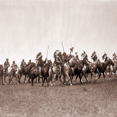 Brule Sioux War Party by Edward S Curtis (American, 1868 - 1952); sepia-toned photograph, circa 1907