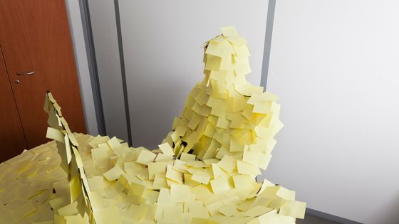 Un homme à son bureau recouvert de post-it ©Getty - Paul Harizan
