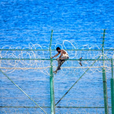 SPAIN-MOROCCO-EUROPE-MIGRANTS(A migrant forces his way into the Spanish territory of Ceuta on August 30, 2019)