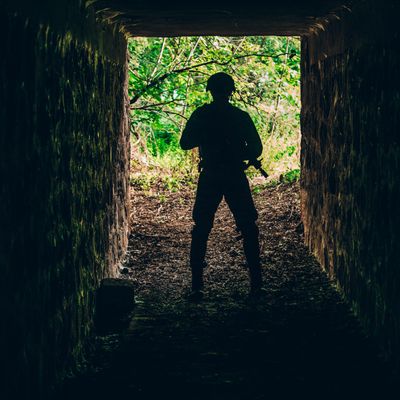 Military soldier standing in the underpass