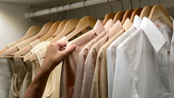 Cropped Image Of Man Touching Clothes Hanging On Rack - Photos - Khatawut Chaemchamras / EyeEm