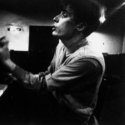 Glenn Gould singing as he samples piano at Steinway warehouse before choosing one for his recording session at Columbia Recording studios.