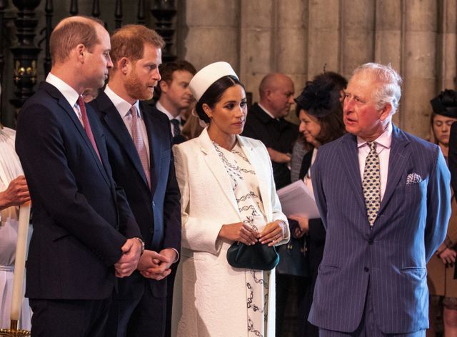Le prince Charles, entouré de ses deux fils, William et Harry, et de sa belle-fille, Meghan.