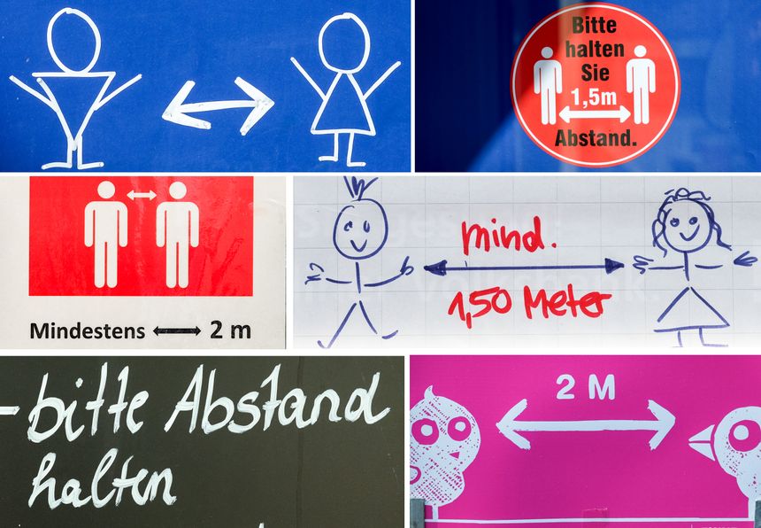 Différents signes de maintien de distance en Allemagne.