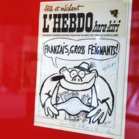 Unes d'Hara-Kiri et de Charlie Hebdo. Photo prise le 21 novembre 2003 au Centre Georges Pompidou à Paris, de dessins de Jean-Marc Reiser, à l'occasion d'une exposition rétrospective.