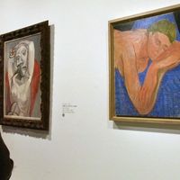 Le "Nu au fauteuil rouge" (1939), huile sur toile de Picasso, et "Le rêve", (1935) huile sur toile de Matisse, en 2002 lors de l'exposition "Matisse-Picasso".