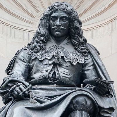 Statue en bronze de Molière située dans le 1er arrondissement de Paris, sur la place Mireille