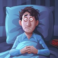 Jeune homme en pleine insomnie dans son lit