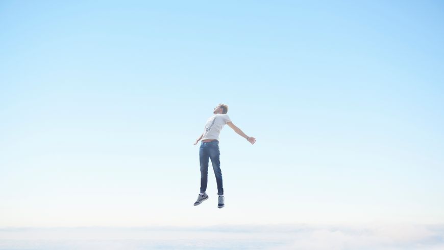 Man floating in sky